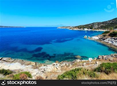 Summer sea scenery with aquamarine transparent water. View from shore (Sithonia, Halkidiki, Greece).