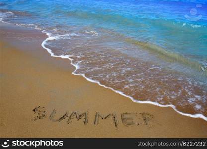 Summer spell written word in sand of a beach in vacation