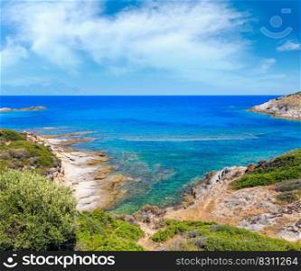 Summer stony sea coast landscape with Atthos mount view in far Halkidiki, Sithonia, Greece .