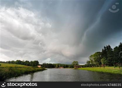 Summer storm landscape. Dramatic cloudy sky. Hurricane and rain in Belarus
