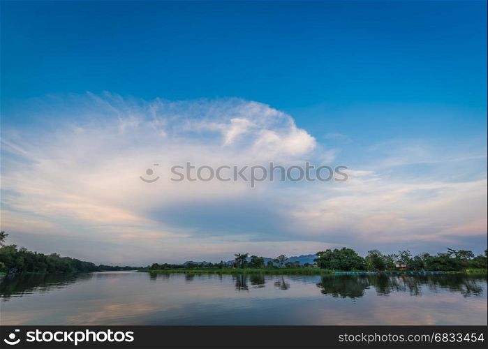 Summer sunset over river in Thailand