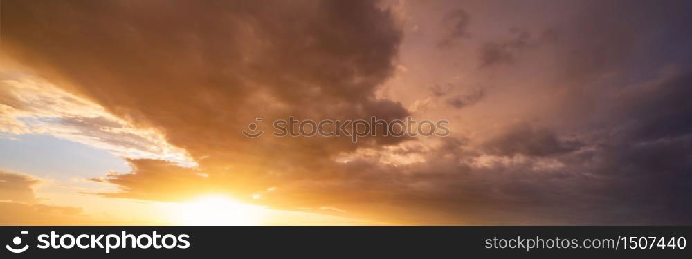 Summer sunset sky panorama with fleece colorful clouds. Evening dusk good weather natural background.