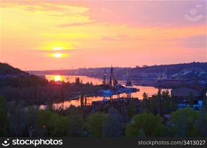 Summer sunset view of Sevastopol Town environs (Crimea, Ukraine) and small sea bay behind