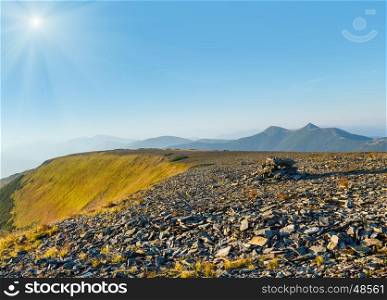 Summer sunshiny Carpathian mountain top view from stony summit of Ihrovets Mount (Gorgany, Ukraine).