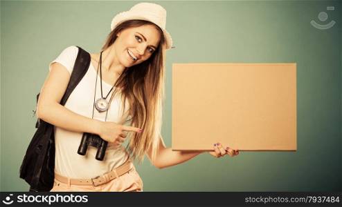 Summer tourism active lifestyle concept. Woman happy female tourist hitchhiking with blank sign cardboard