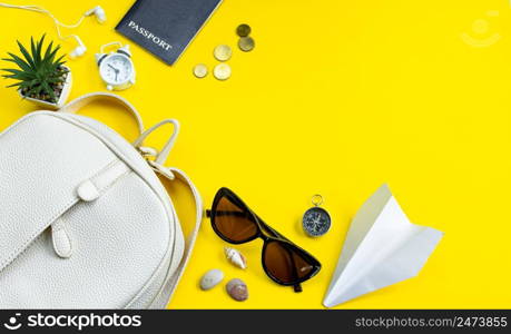 Summer travel concept. Traveler&rsquo;s accessories. Passport, money, sunglasses on a yellow background. Place for your text, flatlay.. Summer travel concept. Traveler&rsquo;s accessories. Passport, money, sunglasses on a yellow background. Flatlay.