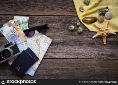 Summer travel stuff on a wooden background with marine details