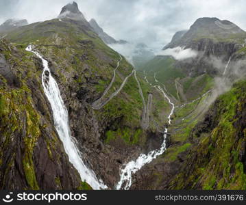 Summer Trollstigen serpentine mountain path road and Stigfossen waterfall view from The Trolls Path Viewpoint, Norway