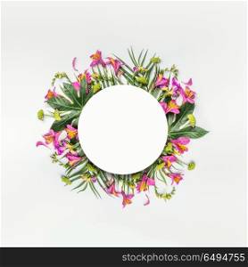 Summer tropical round flowers composition frame with palm leaves on white background