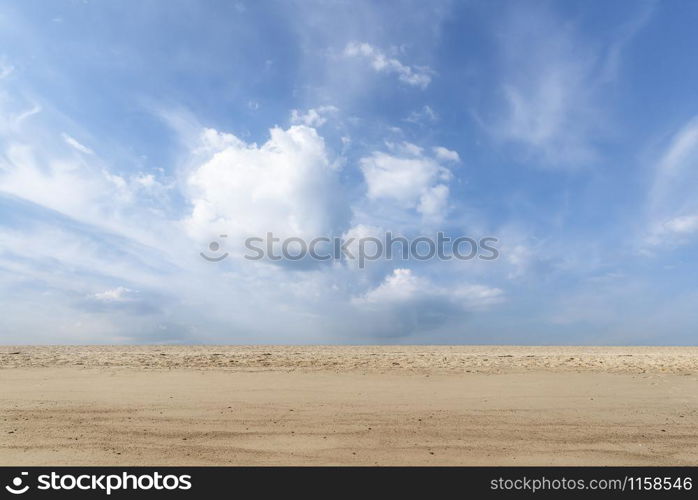 Summer vacation background with sandy beach and blue sky with clouds, on Sylt island, Germany, at North Sea. Beach landscape and sand. Desert and sky