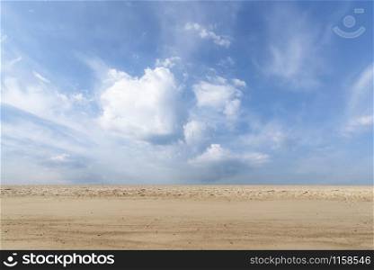 Summer vacation background with sandy beach and blue sky with clouds, on Sylt island, Germany, at North Sea. Beach landscape and sand. Desert and sky