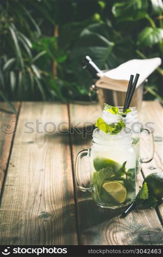 Summer vacation concept: summer cocktails on tropical leaves background. Summer vacation concept