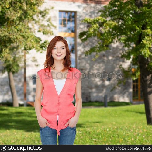 summer vacation, education and people concept - smiling teenage girl in casual clothes over campus background