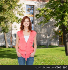 summer vacation, education and people concept - smiling teenage girl in casual clothes over campus background