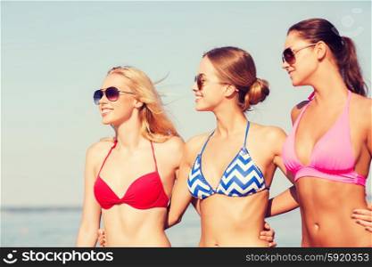 summer vacation, holidays, friendship and people concept - group of smiling young women in sunglasses