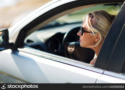 summer vacation, holidays, travel, road trip and people concept - happy smiling teenage girl or young woman in car