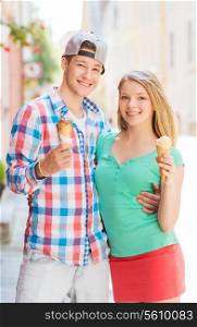 summer, vacation, love and friendship concept - smiling couple with ice-cream in city