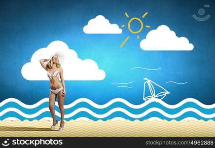 Summer vacation. Pretty girl in white bikini and hat on summer beach