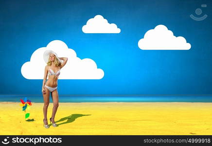 Summer vacation. Pretty girl in white bikini and hat on summer beach