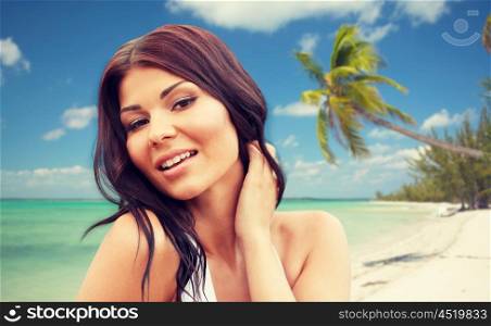 summer vacation, tourism, travel, holidays and people concept -face of happy young woman on tropical beach background