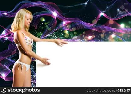 Summer vacation. Young attractive blond in bikini holding blank banner
