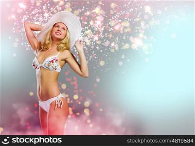 Summer vacation. Young pretty blonde woman in hat and bikini