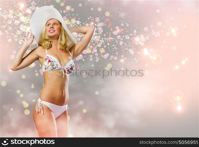 Summer vacation. Young pretty blonde woman in hat and bikini