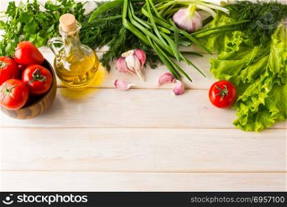 Summer vegetables and olive oil background. Summer vegetables and olive oil background, place for text. Ripe vegetables. Fresh vegetables. Healthy eating concept. Vegetarian food. Healthy eating.