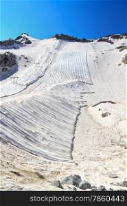 summer view in Presena glacier with geotextile fabrics, Italian Alps
