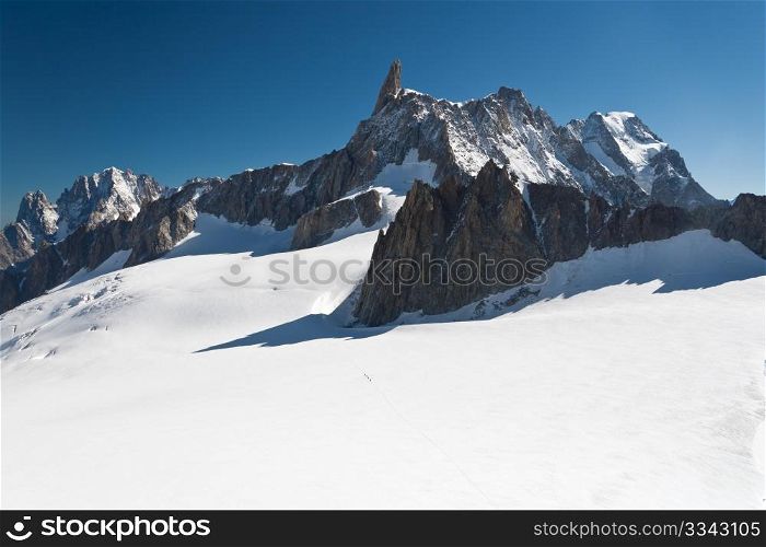 summer view of Dent du Geant peak and glacier in Mont Blanc massif