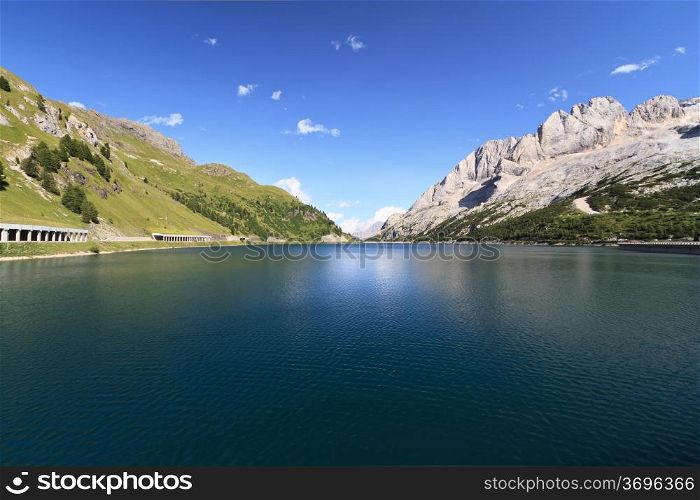 summer view of Fedaia lake and pass, Trentino, Italy