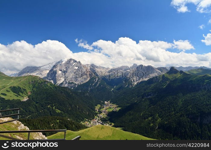 summer view of high Fassa valley with Canazei village and mount Marmolada, Italian Dolomites