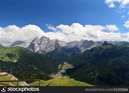 summer view of high Fassa valley with Canazei village and mount Marmolada, Italian Dolomites