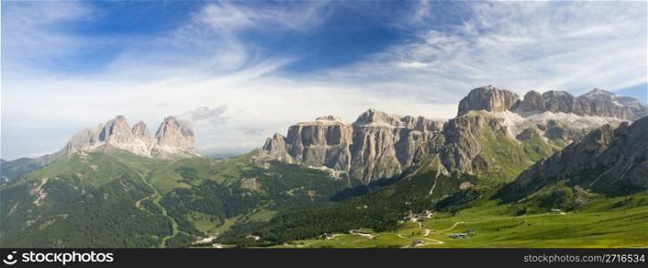 summer view of italian Dolomites in val di fassa near pordoi pass with Sassolungo - Langkofel mount and Sella group. Photo taken with polarizer filter
