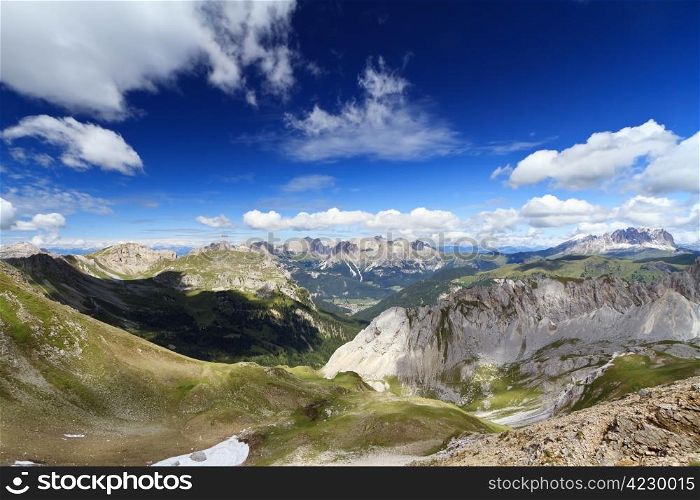 summer view of Monzoni valley with Sassolungo and Catinaccio mount on background, Italian Dolomites
