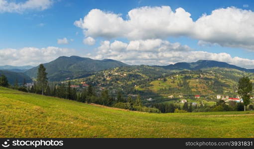 Summer view of mountain village outscirts (Slavske village, Ukraine, Carpathian Mts).