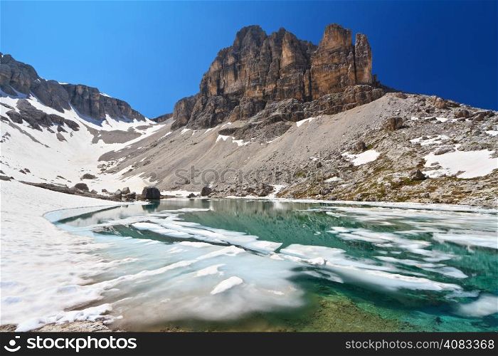 summer view of Pisciadu lake and Sas de Lech peak in Sella mountain, sudtirol, Italy