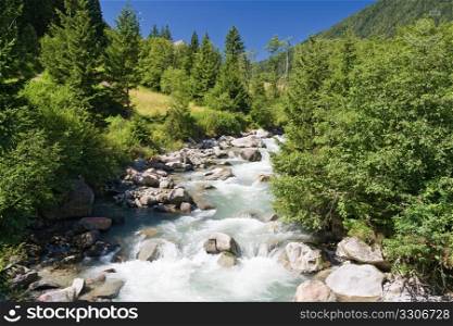 summer view of Vermigliana stream in Italian Alps