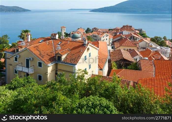 Summer view on houses with red roof and Bay of Kotor from Forte Mare castle (Herceg Novi, Montenegro)