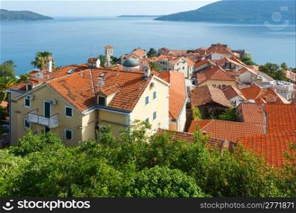 Summer view on houses with red roof and Bay of Kotor from Forte Mare castle (Herceg Novi, Montenegro)