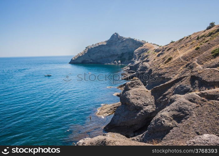 Summer view seacoast. Warm sea and beautiful nature. Sudak beach. Black Sea, Ukraine