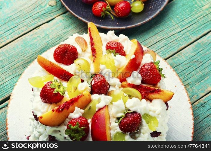 Summer watermelon pie with fruit and whipped cream. Sweet dessert. Colorful cake with watermelon and berries.