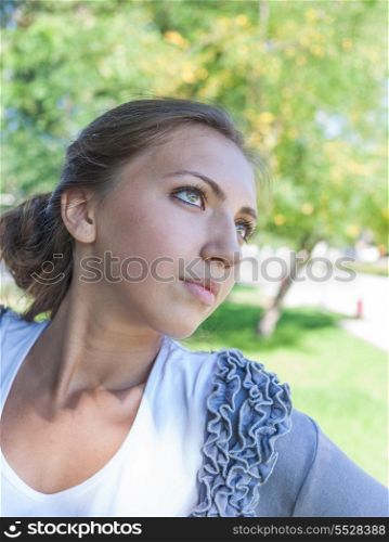 Summer woman portrait. Caucasian female model outside.