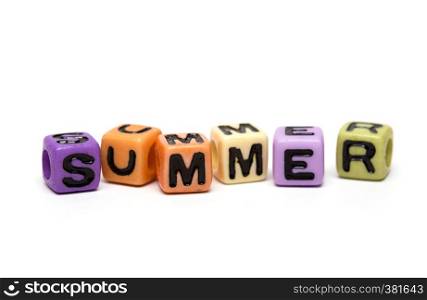 summer - word made from multicolored child toy cubes with letters