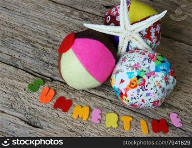 Summertime background, handmade colorful ball, color star fish from fabric, summer is time to beach travel and have fun