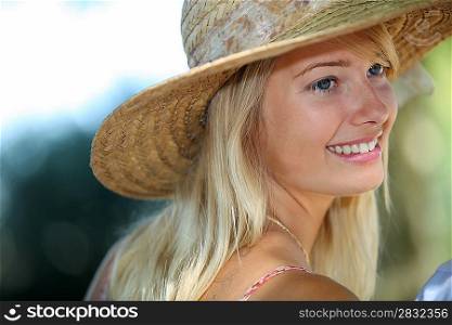 Summery woman in a straw hat