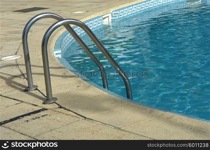 summing pool blue water detail in summer time