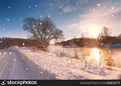 Sun and snowflakes. Sunny winter morning on a river, Belarus
