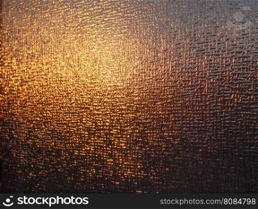 Sun behind a glass. Sun shining through a glass at sunset useful as a background