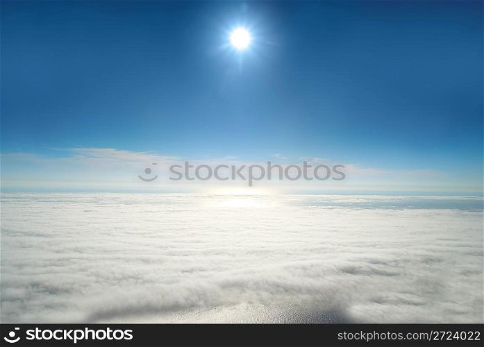 Sun, blue sky, and ocean of clouds